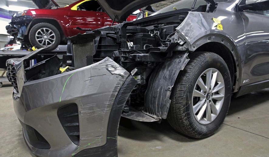 A Kia which was damaged after being stolen is seen at an auto repair shop in Milwaukee on Wednesday, Jan. 27, 2021.  Some Hyundai and Kia cars and SUVs are missing a key anti-theft device, and the crooks have figured it out. An insurance industry group says they&#x27;re being stolen at a rate nearly double the rest of the auto industry because they don&#x27;t have computer chips in the keys. (Angela Peterson//Milwaukee Journal-Sentinel via AP) **FILE**