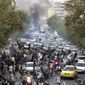 In this photo taken by an individual not employed by the Associated Press and obtained by the AP outside Iran, protesters chant slogans during a protest over the death of a woman who was detained by the morality police, in downtown Tehran, Iran, Sept. 21, 2022.  (AP Photo, File)