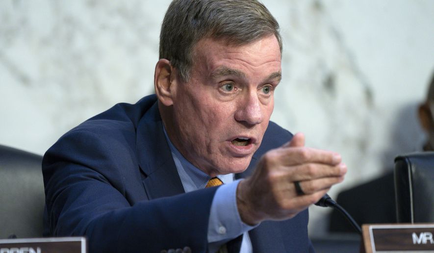 Sen. Mark Warner, D-Va., questions the panel during a Senate Banking Committee annual Wall Street oversight hearing, Thursday, Sept. 22, 2022, on Capitol Hill in Washington. (AP Photo/Jacquelyn Martin)