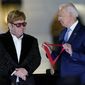 President Joe Biden presents Elton John with the National Humanities Medal after a concert on the South Lawn of the White House in Washington, Friday, Sept. 23, 2022. (AP Photo/Susan Walsh)