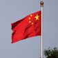 A Chinese national flag flies at Tiananmen Square in Beijing Thursday, June 14, 2018. A court in northern China sentenced one man to 24 years in jail Friday, Sept. 23, 2022, for his role in a vicious attack on four women, as well as other crimes including robbery and opening an illegal gambling ring. (AP Photo/Andy Wong, File)