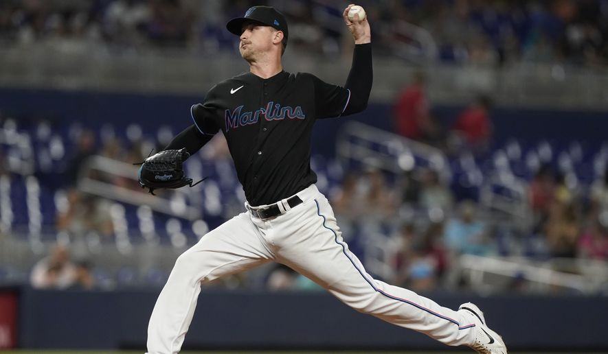 Miami Marlins starting pitcher Braxton Garrett aims a pitch during the third inning of a baseball game against the Washington Nationals, Friday, Sept. 23, 2022, in Miami. The Marlins defeated the Nationals 5-2. (AP Photo/Marta Lavandier)