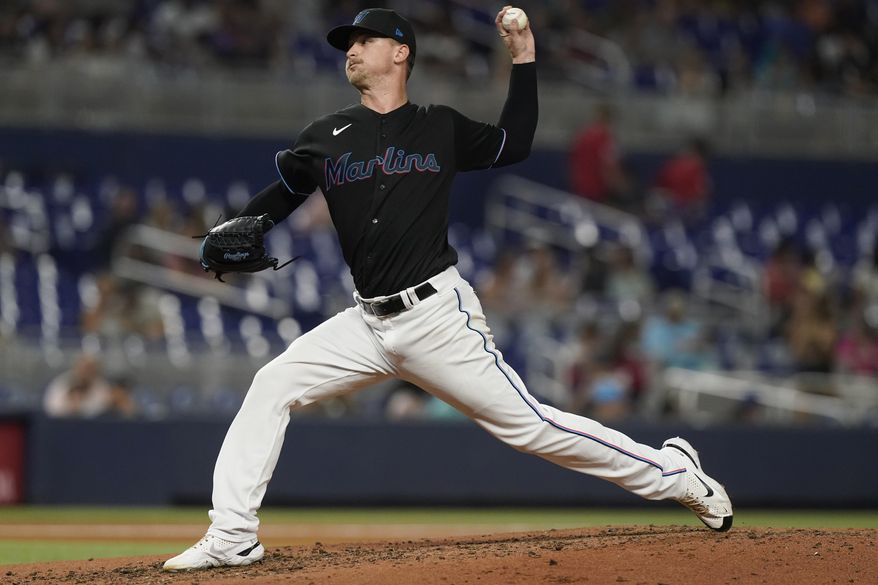 Miami Marlins starting pitcher Braxton Garrett aims a pitch during the third inning of a baseball game against the Washington Nationals, Friday, Sept. 23, 2022, in Miami. The Marlins defeated the Nationals 5-2. (AP Photo/Marta Lavandier)