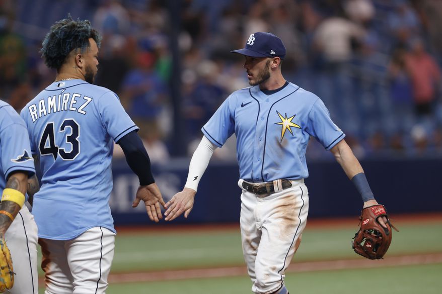 Tampa Bay Rays&#x27; Miles Mastrobuoni, right, celebrates with the Rays&#x27; Harold Ramirez during a baseball game Friday, Sept. 23, 2022, in St. Petersburg, Fla. (AP Photo/Scott Audette)