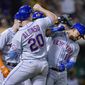 New York Mets&#39; Eduardo Escobar, right, celebrates with Pete Alonso after hitting a grand slam against the Oakland Athletics during the fifth inning of a baseball game in Oakland, Calif., Friday, Sept. 23, 2022. (AP Photo/Godofredo A. Vásquez)