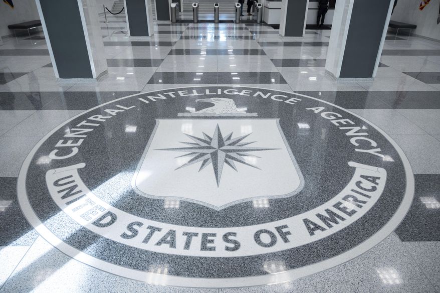The seal of Central Intelligence Agency is seen in the lobby the headquarters building in Langley, Va., on Saturday, Sept. 24, 2022. (AP Photo/Kevin Wolf)