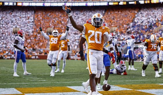 Tennessee running back Jaylen Wright (20) celebrates a touchdown during the second half of the team&#39;s NCAA college football game against Florida on Saturday, Sept. 24, 2022, in Knoxville, Tenn. Tennessee won 38-33. (AP Photo/Wade Payne) **FILE**