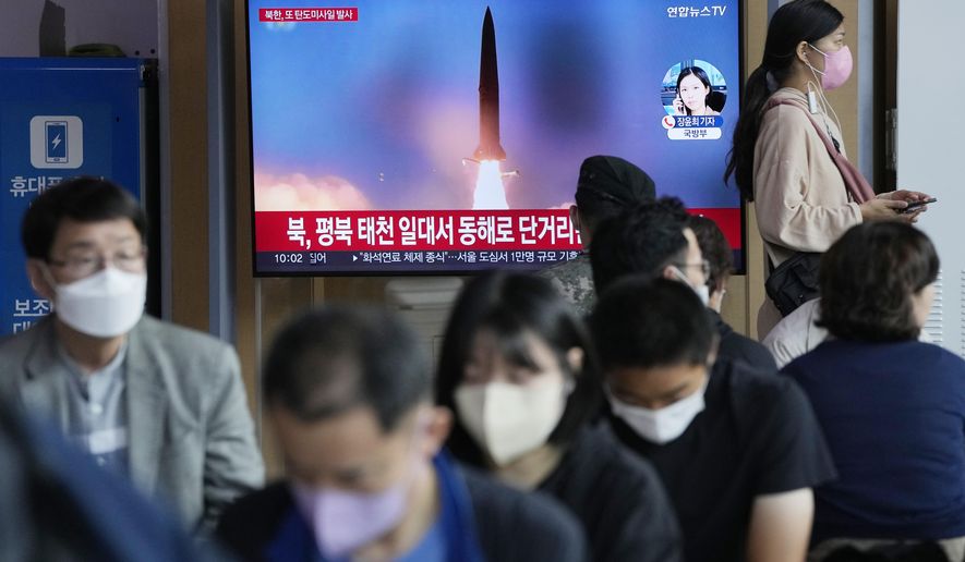 A file image of a missile launch by North Korea is shown on a news program at the Seoul Railway Station in Seoul, South Korea, Sunday, Sept. 25, 2022. North Korea fired a short-range ballistic missile Sunday toward its eastern seas, extending a provocative streak in weapons testing as a U.S. aircraft carrier visits South Korea for joint military exercises in response to the North&#x27;s growing nuclear threat.(AP Photo/Ahn Young-joon)