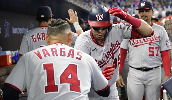 Washington Nationals&#39; Joey Meneses, right, celebrates with Ildemaro Vargas (14) after hitting a two run home run during the first inning of a baseball game against the Miami Marlins, Sunday, Sept. 25, 2022, in Miami.(AP Photo/Lynne Sladky) **FILE**