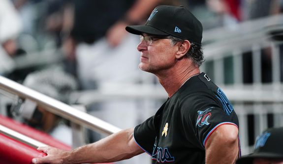 Miami Marlins manager Don Mattingly looks on from the dugout during a baseball game against the Atlanta Braves, Friday, Sept. 2, 2022, in Atlanta. (AP Photo/John Bazemore) **FILE**