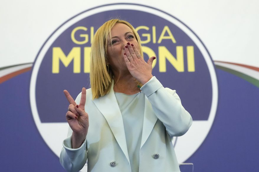 Far-Right party Brothers of Italy&#39;s leader Giorgia Meloni flashes the victory sign at her party&#39;s electoral headquarters in Rome, early Monday, Sept. 26, 2022. Italian voters rewarded Giorgia Meloni&#39;s euroskeptic party with neo-fascist roots, propelling the country toward what likely would be its first far-right-led government since World War II, based on partial results Monday from the election for Parliament. (AP Photo/Gregorio Borgia)
