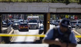 Chicago police respond to a shooting near the CPD Homan Square facility Monday, Sept. 26, 2022.  One person was shot and a Chicago police officer was wounded Monday during an incident inside a police facility on the city&#x27;s West Side, officials said. (Brian Cassella/Chicago Tribune via AP)