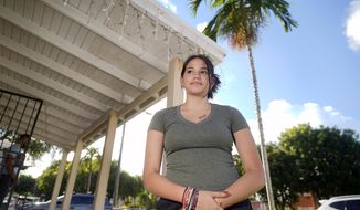 Adismarys Abreu, 16, poses for a photo at her home, Tuesday, Aug. 23, 2022, in Miami. Abreu had been discussing a long-lasting birth control implant with her mother for about a year as a potential solution to increasing menstrual pain. Then Roe v. Wade was overturned, and Abreu joined the throng of teens rushing to their doctors as states began to ban or severely limit abortion. (AP Photo/Wilfredo Lee)