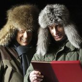 FILE - Russian President Vladimir Putin, right, presents a book about his rural lodge Zavidovo to former Italian Prime Minister Silvio Berlusconi in Zavidovo, about 120 kilometers (75 miles) northwest of Moscow, Monday, Feb. 3, 2003. Just in time to celebrate his 86th birthday, Italy&#x27;s former premier Silvio Berlusconi is making his return to Italy&#x27;s parliament, winning a seat in the Senate nearly a decade after being banned from public office over a tax fraud conviction. (AP Photo/Viktor Korotayev, Pool, File)