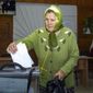An elderly woman casts her ballot during a referendum in Luhansk, Luhansk People&#39;s Republic controlled by Russia-backed separatists, eastern Ukraine, Monday, Sept. 26, 2022. Voting began last Friday in four Moscow-held regions of Ukraine on referendums to become part of Russia. (AP Photo)