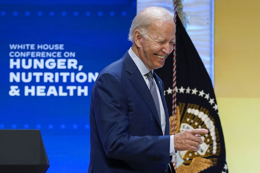 President Joe Biden points to the crowd after speaking during the White House Conference on Hunger, Nutrition, and Health, at the Ronald Reagan Building, Wednesday, Sept. 28, 2022, in Washington. (AP Photo/Evan Vucci)