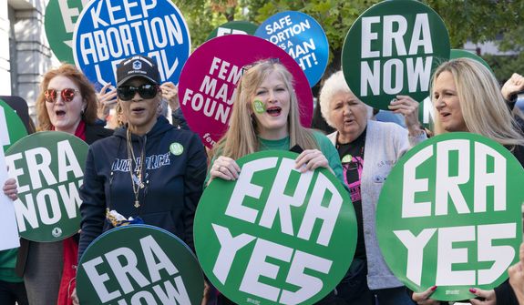 Demonstrators protest outside of the federal courthouse asking congress to pass the equal rights amendment, during a rally in Washington, Wednesday, Sept. 28, 2022. ( AP Photo/Jose Luis Magana)