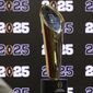 The National Championship Trophy is displayed following a news conference Aug. 16, 2022, in Atlanta, announcing that the CFP National Championship NCAA college football game will be played at Mercedes-Benz Stadium in 2025. The conference commissioners who manage the College Football Playoff met for almost seven hours Tuesday, Sept. 27, to work on expanding the postseason system from four to 12 teams as soon as the 2024 season. There is still much work to be done. (Jason Getz/Atlanta Journal-Constitution via AP, File) **FILE**