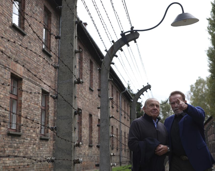 Arnold Schwarzenegger, right, and Simon Bergson, chairman of The Auschwitz Jewish Center Foundation visit Auschwitz - Birkenau Nazi German death camp in Oswiecim, Poland, Wednesday, Sept. 28, 2022. Film icon Schwarzenegger visited the site of the Nazi German death camp Auschwitz on Wednesday to send a message against hatred. The &amp;quot;Terminator&amp;quot; actor was given a tour of the site, viewing the barracks watchtowers and the remains of gas chambers that endure as evidence of the German extermination of Jews, Roma and others during World War II. (AP Photo/Michal Dyjuk)