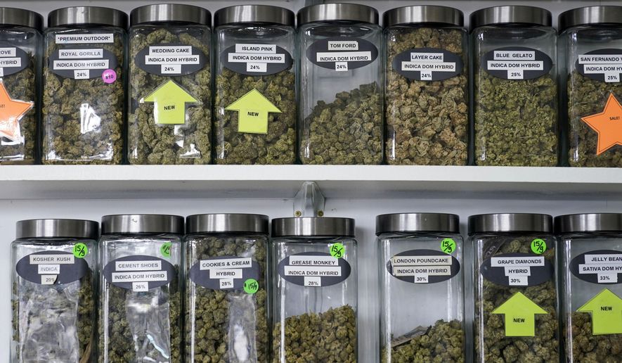 FILE — Marijuana products are displayed at the Good Leaf Dispensary, on the reservation Mohawks call Akwesasne, Monday, March 14, 2022, in St. Regis, N.Y. New York began accepting applications, Thursday, Aug. 25, 2022, to open its first crop of legal recreational pot shops, taking a novel approach by reserving the first licenses for people with past pot convictions or their relatives. (AP Photo/Seth Wenig, File)