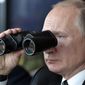 Russian President Vladimir Putin holds binoculars while watching the military exercises Center-2019 at Donguz shooting range near Orenburg, Russia, in Sept. 20, 2019. Russian President Vladimir Putin has warned that he wouldn&#39;t hesitate to use nuclear weapons to ward off Ukraine&#39;s attempt to reclaim control of its occupied regions that Moscow is about to absorb. (Alexei Nikolsky, Sputnik, Kremlin Pool Photo via AP, File)