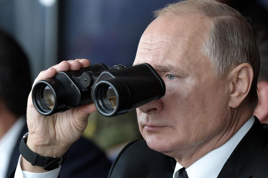 Russian President Vladimir Putin holds binoculars while watching the military exercises Center-2019 at Donguz shooting range near Orenburg, Russia, in Sept. 20, 2019. Russian President Vladimir Putin has warned that he wouldn&#39;t hesitate to use nuclear weapons to ward off Ukraine&#39;s attempt to reclaim control of its occupied regions that Moscow is about to absorb. (Alexei Nikolsky, Sputnik, Kremlin Pool Photo via AP, File)