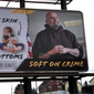 New Mehmet Oz campaign billboard features the phrase &quot;soft on skin, soft on bottoms, soft on crime&quot; opposite Pennsylvania Democratic candidate for U.S. Senate John Fetterman. Photo by Seth McLaughlin.