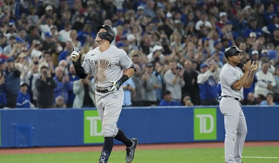 New York Yankees&#39; Aaron Judge celebrates his 61st home run of the season, a two-run shot against the Toronto Blue Jays during the seventh inning of a baseball game Wednesday, Sept. 28, 2022, in Toronto. (Nathan Denette/The Canadian Press via AP) **FILE**