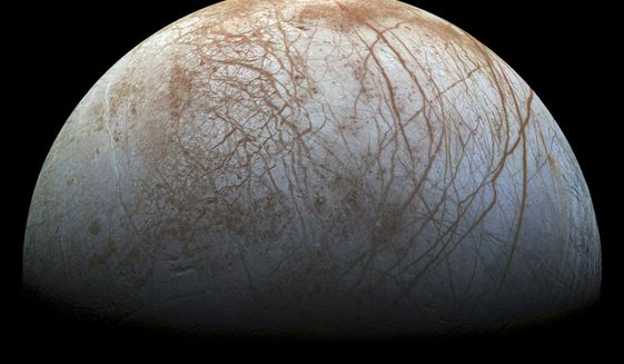 This image made available by NASA in 2014 shows Jupiter&#39;s icy moon Europa in a reprocessed color view, made from images captured by NASA&#39;s Galileo spacecraft in the late 1990s. NASA’s Juno spacecraft made the closest approach to Jupiter’s tantalizing, icy moon Europa in more than 20 years on Thursday, Sept. 29, 2022. (NASA/JPL-Caltech/SETI Institute via AP)