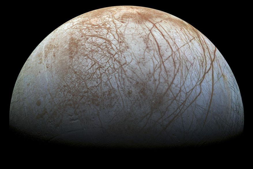 This image made available by NASA in 2014 shows Jupiter&#x27;s icy moon Europa in a reprocessed color view, made from images captured by NASA&#x27;s Galileo spacecraft in the late 1990s. NASA’s Juno spacecraft made the closest approach to Jupiter’s tantalizing, icy moon Europa in more than 20 years on Thursday, Sept. 29, 2022. (NASA/JPL-Caltech/SETI Institute via AP)