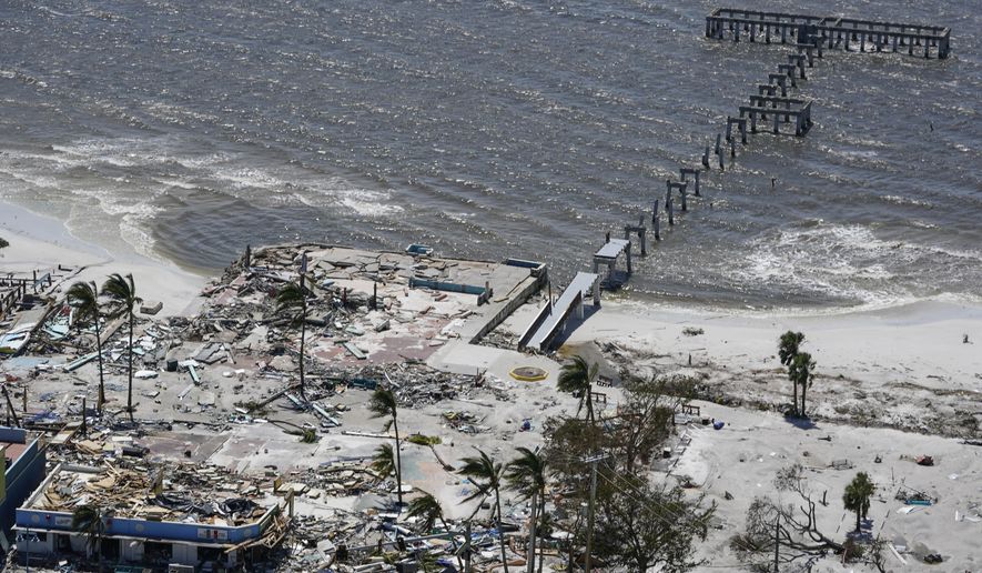 The remnant of a pier is seen in the wake of Hurricane Ian, Thursday, Sept. 29, 2022, in Fort Myers Beach, Fla. (AP Photo/Wilfredo Lee)