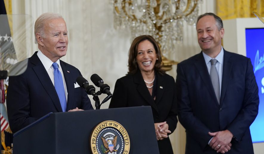President Joe Biden speaks during a reception to celebrate the Jewish new year in the East Room of the White House in Washington, Friday, Sept. 30, 2022. Vice President Kamala Harris and her husband Doug Emhoff stand at right. (AP Photo/Susan Walsh)