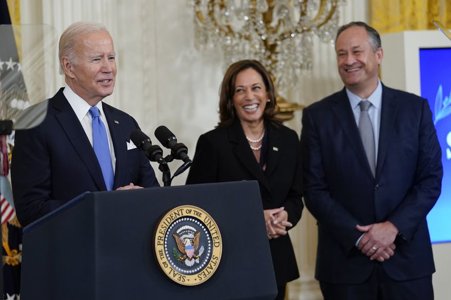 President Joe Biden speaks during a reception to celebrate the Jewish new year in the East Room of the White House in Washington, Friday, Sept. 30, 2022. Vice President Kamala Harris and her husband Doug Emhoff stand at right. (AP Photo/Susan Walsh)