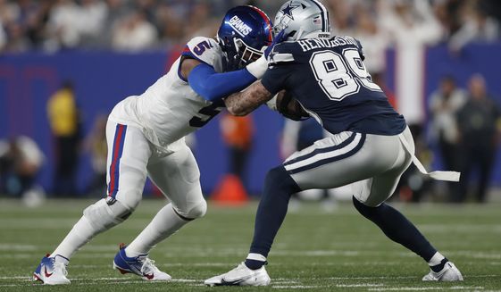 New York Giants defensive end Kayvon Thibodeaux (5) battles against Dallas Cowboys tight end Peyton Hendershot (89) during an NFL football game, Monday, Sept. 26, 2022, in East Rutherford, N.J. The Dallas Cowboys won 23-16. (AP Photo/Steve Luciano)