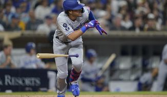 Los Angeles Dodgers&#39; Miguel Vargas watches his two-run single during the sixth inning of the team&#39;s baseball game against the San Diego Padres, Thursday, Sept. 29, 2022, in San Diego. (AP Photo/Gregory Bull)