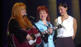 FILE - Wynonna, Naomi, and Ashley Judd appear during Wynonna&#39;s concert in Ashland, Ky., on Jan. 19, 2002. Fans will have a chance to say goodbye to Naomi Judd, the late matriarch of the Grammy-winning country duo The Judds, on a tour starting Friday. Wynonna Judd will helm the 11-city tour. (John Flavell/The Daily Independent via AP, File)