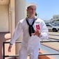 US Navy sailor Ryan Sawyer Mays walks past reporters at Naval Base San Diego before entering a Navy courtroom, Aug. 17, 2022, in San Diego. No one disputes that the Navy shares blame for the loss of the USS Bonhomme Richard, the $1.2 billion amphibious assault ship that was consumed by flames in San Diego in July 2020 as officers failed to respond quickly and its crew struggled with broken equipment. But none of that would not have happened, according to prosecution closing arguments, Thursday, Sept. 29, 2022, without Ryan Sawyer Mays. (AP Photo/Julie Watson, File)