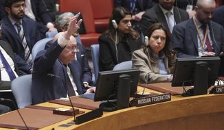 Russian Ambassador to the United Nations Vasily Nebenzya raises his hand against a U.N. Security Council vote on a draft resolution sanctioning Russia&#x27;s planned annexation of war-occupied Ukraine territory, Friday Sept. 30, 2022 at U.N. headquarters. (AP Photo/Bebeto Matthews)