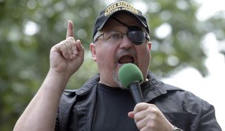 Stewart Rhodes, founder of the Oath Keepers, speaks during a rally outside the White House in Washington, June 25, 2017. In his trial in the violent Jan. 6, 2021 attack on the U.S. Capitol, attorneys for the leader of the Oath Keepers extremist group will mount an unusual defense with former President Donald Trump at its center. Defense attorneys are poised to argue that Rhodes can’t be found guilty of seditious conspiracy because everything he did was in preparation for orders he anticipated coming down from the Republican president. (AP Photo/Susan Walsh, File)
