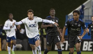 CF Montreal&#39;s Rida Zouhir, right, looks to pass as D.C. United&#39;s Ravel Morrison approaches during the second half half of an MLS soccer match Saturday, Oct. 1, 2022, in Montreal. (Peter McCabe/The Canadian Press via AP) **FILE**