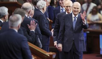 President Russell M. Nelson, of The Church of Jesus Christ of Latter-day Saints, waves to other general authorities prior to the Saturday morning session of the 192nd Semiannual General Conference of The Church of Jesus Christ of Latter-day Saints in Salt Lake City on Saturday, Oct. 1, 2022.  (Jeffrey D. Allred /The Deseret News via AP)