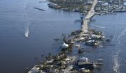 The bridge leading from Fort Myers to Pine Island, Fla., is heavily damaged in the aftermath of Hurricane Ian, Saturday, Oct. 1, 2022. Due to the damage, the island can only be reached by boat or air. (AP Photo/Gerald Herbert)