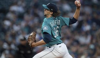 Seattle Mariners starter Logan Gilbert delivers a pitch during the first inning of the team&#39;s baseball game against the Oakland Athletics, Friday, Sept. 30, 2022, in Seattle. (AP Photo/Stephen Brashear)