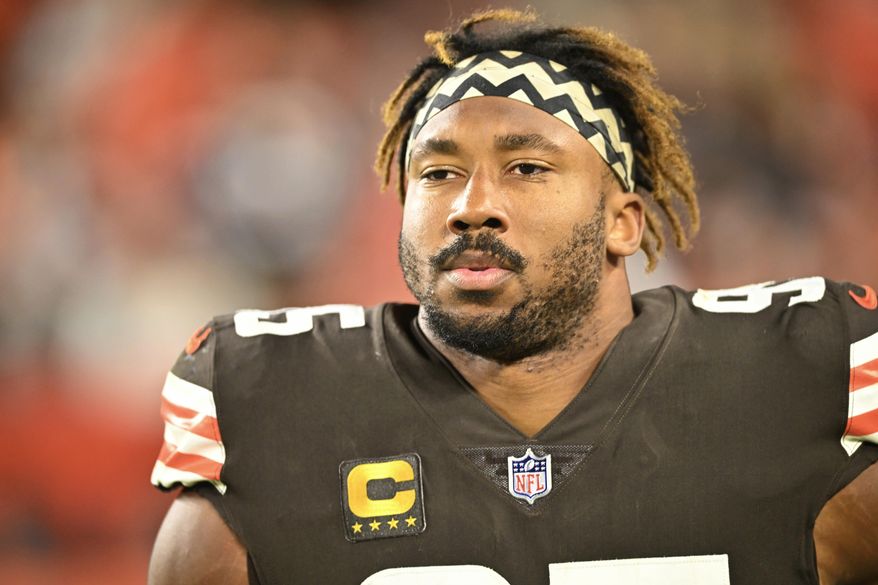 Cleveland Browns defensive end Myles Garrett (95) walks on the field during an NFL football game against the Pittsburgh Steelers, Sept. 22, 2022, in Cleveland. Garrett was released from a hospital late Monday, Sept. 26, after he was injured when he rolled over his Porsche while driving on a rural road following practice. (AP Photo/David Richard, File)