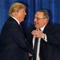 Republican presidential candidate Donald Trump is welcomed to the stage by Maine Gov. Paul LePage at campaign stop in Portland, Maine, in this March 3, 2016 file photo. LePage, who moved to Florida after his second term, has returned to Maine to challenge Democratic Gov. Janet Mills. (AP Photo/Robert F. Bukaty)