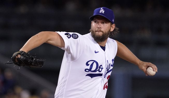 Los Angeles Dodgers starting pitcher Clayton Kershaw throws to the plate during the first inning of a baseball game against the Colorado Rockies Friday, Sept. 30, 2022, in Los Angeles. (AP Photo/Mark J. Terrill)
