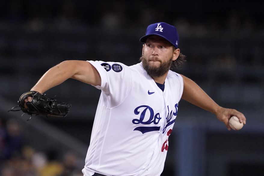 Los Angeles Dodgers starting pitcher Clayton Kershaw throws to the plate during the first inning of a baseball game against the Colorado Rockies Friday, Sept. 30, 2022, in Los Angeles. (AP Photo/Mark J. Terrill)