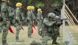 In this photo released by the Taiwan Presidential Office, Taiwanese soldiers go through a drill as Taiwan&#x27;s President Tsai Ing-wen visits a camp in Hualien, in eastern Taiwan on Tuesday, Sept. 6, 2022. Taiwanese President Tsai Ing-wen said Tuesday that China is conducting &amp;quot;cognitive warfare&amp;quot; by spreading misinformation in addition to its regular incursions into nearby waters and airspace intended at intimidating the self-governing island. (Taiwan Presidential Office via AP)