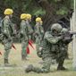 In this photo released by the Taiwan Presidential Office, Taiwanese soldiers go through a drill as Taiwan&#39;s President Tsai Ing-wen visits a camp in Hualien, in eastern Taiwan on Tuesday, Sept. 6, 2022. Taiwanese President Tsai Ing-wen said Tuesday that China is conducting &amp;quot;cognitive warfare&amp;quot; by spreading misinformation in addition to its regular incursions into nearby waters and airspace intended at intimidating the self-governing island. (Taiwan Presidential Office via AP)