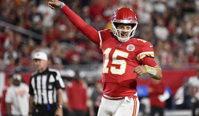 Kansas City Chiefs quarterback Patrick Mahomes (15) celebrates a touchdown during the first half of an NFL football game against the Tampa Bay Buccaneers Sunday, Oct. 2, 2022, in Tampa, Fla. (AP Photo/Jason Behnken)